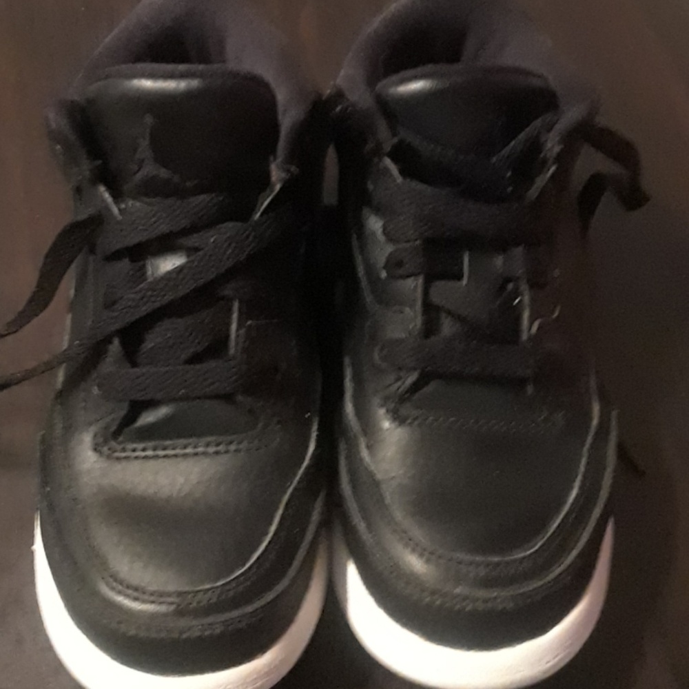 Little boy black Jordan sneaker